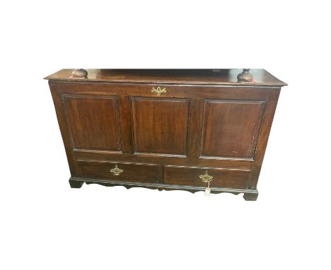 A George III oak mule chest, the triple panelled front above two drawers on bracket feet, height 87cm, width 137cm.