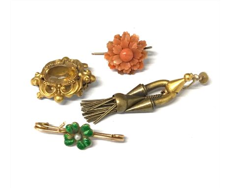 A citrine gold mounted brooch, a coral single earring, a revivalist single earring and an enamel brooch.