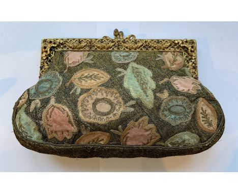 Appliqué and embroidered evening clutch purse with ornate, jewel set gilt frame, decorated with swags and bows, the clasp set