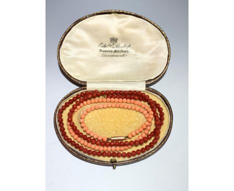 A pink coral necklace with 9ct. clasp and a red coral necklace with 18ct. bolt ring.