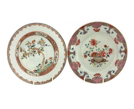 Two Chinese famille rose plates, 18th century, of circular form, one painted with a basket of flowers, the other with preciou