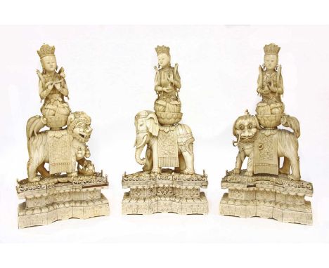 Three Chinese ivory carvings, 19th century, each with a bodhisattva wearing beaded jewellery holding a vase or a ruyi sceptre