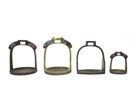 A collection of Chinese cloisonné stirrups, 20th century, each enamelled with florets against a diapered ground, 9.2 to 15.5c