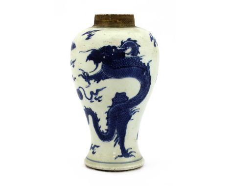 A Chinese blue and white vase,Kangxi (1662-1722), of baluster form, painted with a dragon and a phoenix,18.8cm high清康熙 青花龙凤纹瓶