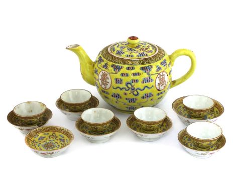 A Chinese famille rose tea service, probably Guangxu (1875-1908), comprising: a teapot, of globular form, painted with rounde