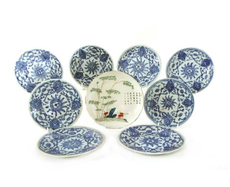 A collection of Chinese blue and white saucers, 19th century, comprising a group of eleven, painted with scrolling lotus, six
