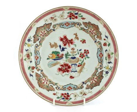 A Chinese famille verte soup plate, early 18th century, of circular form, painted with a blossoming tree in the centre, 22.3c