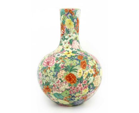 A Chinese famille rose vase, of globular form with a straight neck, decorated with millefleurs pattern, six-character Qianlon