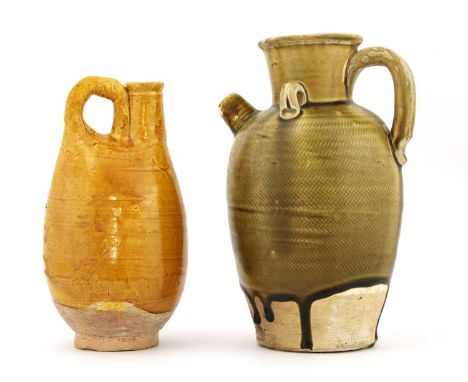Two Chinese pottery ewers, one a leather pouch-form flask, in the Liao style, with finger-pinched, arched handle and cylindri