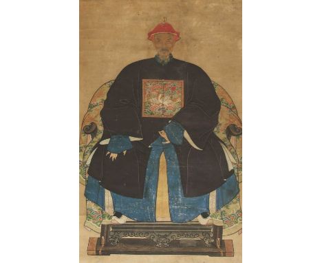 A pair of Chinese ancestor portrait hanging scrolls,early 20th century, of an elderly couple in their court robes with the fi