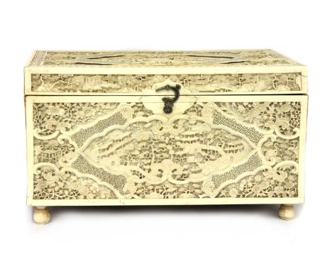A Chinese ivory tea caddy, 19th century, of rectangular form on bun feet, finely carved with figures in a landscape with buil