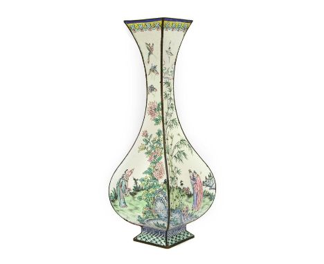 A Chinese Canton enamelled vase,Qing dynasty (1644-1911), of lozenge form, finely painted with figures in a garden, surrounde