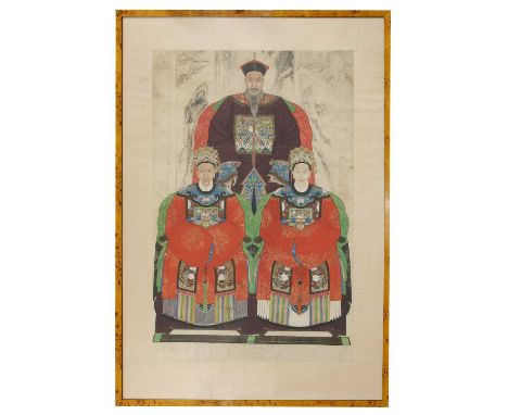 A large Chinese ancestor portrait painting,19th century, of an official and two ladies wearing traditional court robes, seate