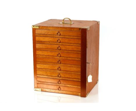 A contemporary light wood and brass mounted nine drawer trinket cabinet,&nbsp;with locking bar mechanism, 35.5cm wide x 43cm 