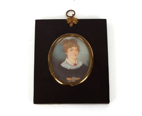 A 19th Century portrait miniature, of Mrs Anne Fawcett wearing dark dress with lace trimmed collar in ebonised and brass moun