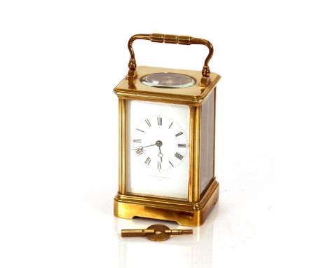 A late 19th Century brass cased carriage clock,&nbsp;with enamelled dial and Roman numerals, by Charles Frodsham &amp; CIE Pa