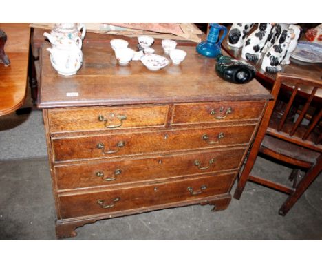 A Georgian&nbsp;oak chest,&nbsp;fitted two short and three long drawers, raised on bracket feet 93cm wide&nbsp;