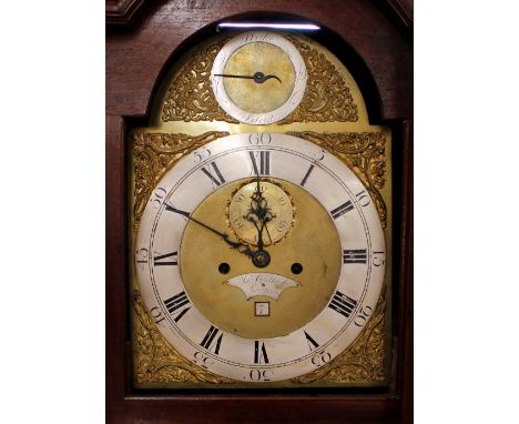 A George III mahogany long case clock,&nbsp;By J Gullock of Rochford, the hood surmounted by a carved pediment and flanked by