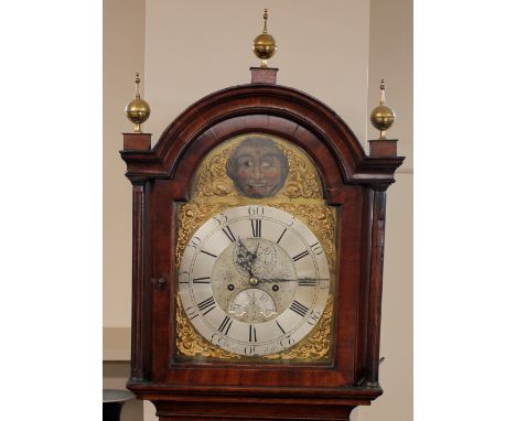 A George III mahogany long case clock,&nbsp;the eight day movement and brass moon face dial by Higdon of Wells surmounted by 