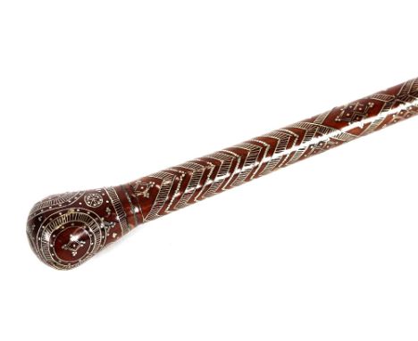 A hardwood walking stick, having white metal inlaid decoration