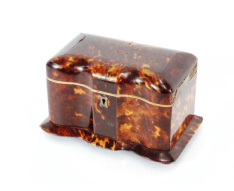 A 19th Century tortoiseshell and ivory mounted two compartment tea caddy,&nbsp;of serpentine shape, 20cm long, 13cm high