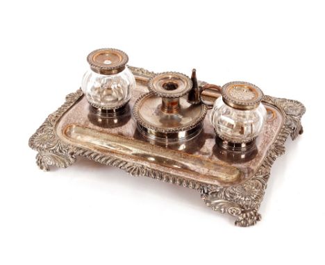 A 19th Century Sheffield plated desk stand,&nbsp;having gadrooned and shell decorated border fitted with a central chamber st