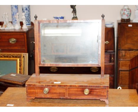 A 19th Century mahogany and boxwood strung toilet mirror, raised on a two drawer box base and bracket feet, 47cm wide, 50cm h