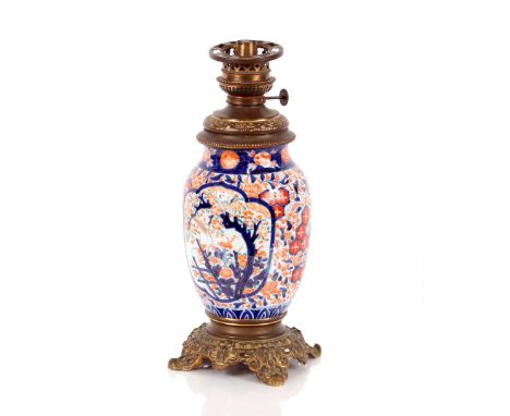 A Japanese&nbsp;Imari baluster oil lamp,&nbsp;having gilded metal mounts, 41cm high overall