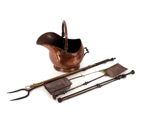 A copper coal helmet,&nbsp;and various iron and brass fire implements including a log fork