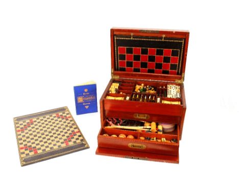 A late Victorian games compendium,&nbsp;comprising turned wooden chess and draughts set, bone and ebony dominoes, an Escalado