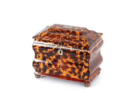 A 19th Century tortoiseshell and white metal strung two compartment tea caddy,&nbsp;of sarcophagus shape 18cm wide x 15cm hig