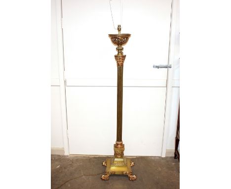 A good quality brass and copper Corinthian&nbsp;column standard&nbsp;lamp, raised on bold claw supports complete with shade, 