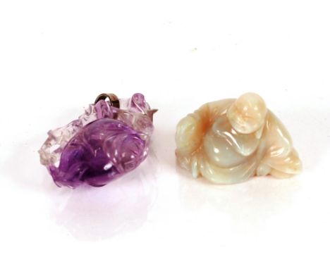 A vintage&nbsp;Chinese amethyst&nbsp;carving,&nbsp;of a fruit with trailing leaves attached with a later white metal loop for