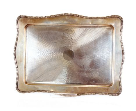 An Art Deco design silver dressing table tray,&nbsp;with shaped border and engine turned central decoration, Birmingham 1930,