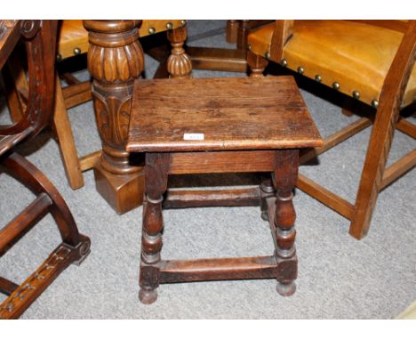 An oak joint stool,&nbsp;raised on baluster supports united by stretchers, 38cm wide, 46cm high