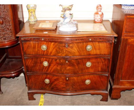 A 19th Century&nbsp;mahogany serpentine fronted chest,&nbsp;fitted brushing slide and three long graduated drawers, raised on