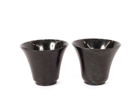 A pair of small spinach jade cups,&nbsp;of tapering form, 5cm high, 6cm dia. overall, contained in a fitted box&nbsp;