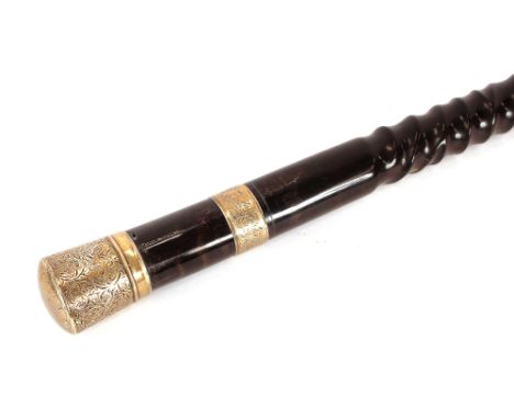 A Victorian ebonised walking stick,&nbsp;of tapering form having foliate engraved silver band and handle