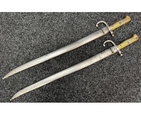 Two French 1866 Pattern Chassepot sword bayonets. Both German made and maker marked for "Alexander Coppel" with scales trade 