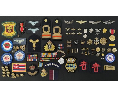 A collection of mixed US and British badges and insignia. Includes US wings and USN and Army rings. WW2 US Victory Medal. WW1