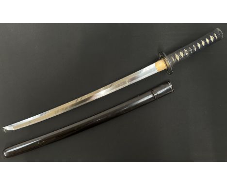 Japanese Wakizashi Sword with single edged blade 540mm in length. Hamon line to cutting edge. Some chips to edge of blade. Ta