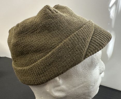 WW2 US Army Woolen Jeep Cap. Offically called "Cap, Wool, Knit, M1941". Complete with original size lable "M" for Medium. Mad