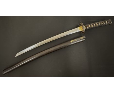 Japanese Wakizashi Sword with single edged blade 490mm in length. Faint Hamon line to cutting edge. Chips along the edge of b