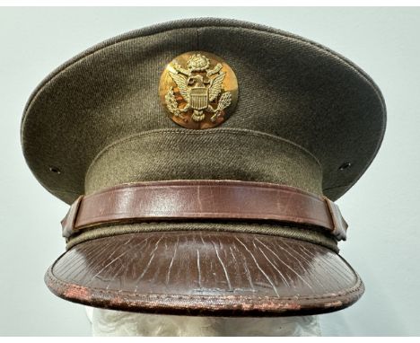 WW2 US Army Enlisted Man's Visor Cap. Complete with cap badge and chinstrap. Size 7 1/8th Named to "Sgt John T Guresky". Also
