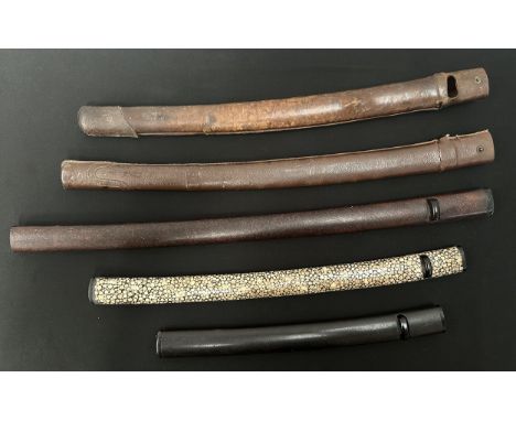 A collection of three Japanese Sword Saya Scabbards including one with Ray Skin wrap, along with two leather covers both a/f.