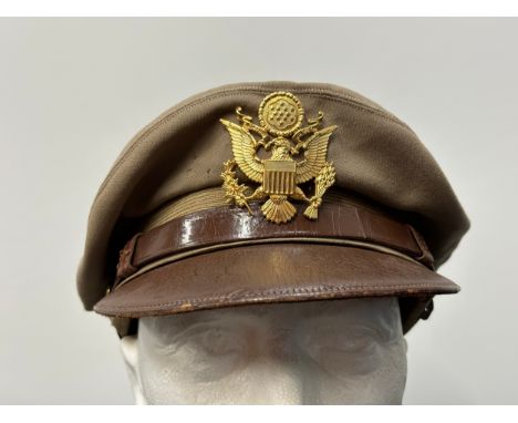 WW2 USAAF/US Army Chino Crusher Cap. Soft brown leather visor with chin strap and strap to rear of cap. Gilt plated cap badge