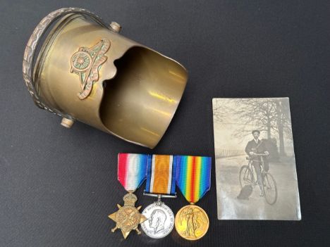 WW1 British 1914-15 Star, British War Medal and Victory Medal to 85557 Gnr. A Parrot, Royal Field Artillery. Mounted on a bar