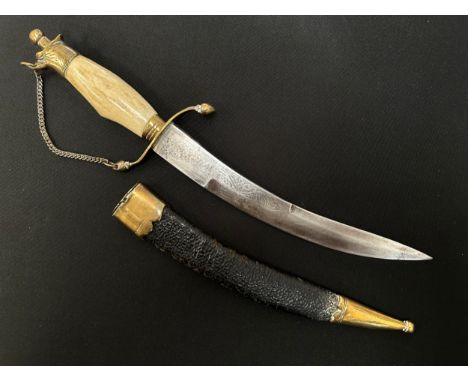 Indian Sikh Kirpan dagger with 210mm curved double edged blade with etched decoration to both sides. Brass crossguard, bone g