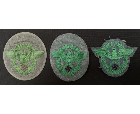 WW2 Third Reich Police Sleeve Eagle group. Two are uniform removed while the third appears unissued. All are new to the marke