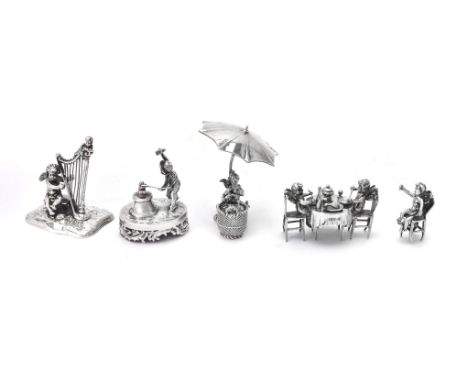 Five Continental silver toys with cherubs by Neresheimer: selling apples from a basket under an umbrella, import marked for L